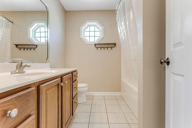 991 Wing Tip Cir, Hopkinsville, KY 42240 - bathroom featuring vanity, toilet, tile patterned floors, shower / tub combo with curtain, and baseboards