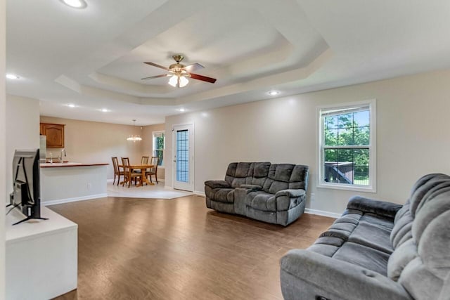 991 Wing Tip Cir, Hopkinsville, KY 42240 - living area with a raised ceiling, plenty of natural light, light wood-style flooring, ceiling fan, and recessed lighting