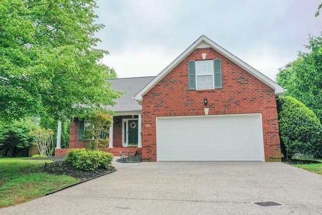 2818 Crazy Horse, Murfreesboro, TN 37127 - view of front of home featuring driveway, brick siding, and an attached garage