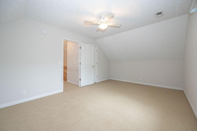 2818 Crazy Horse, Murfreesboro, TN 37127 - additional living space with vaulted ceiling, a ceiling fan, light colored carpet, baseboards, and a textured ceiling
