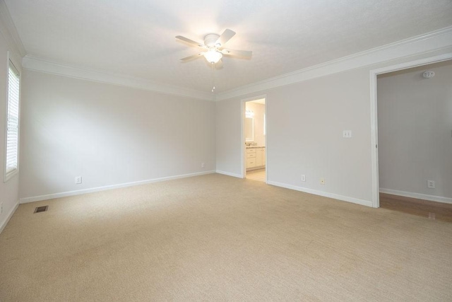 2818 Crazy Horse, Murfreesboro, TN 37127 - spare room with a ceiling fan, ornamental molding, light colored carpet, and baseboards