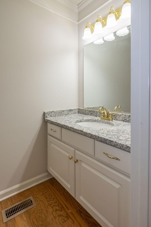 2818 Crazy Horse, Murfreesboro, TN 37127 - bathroom with vanity, wood finished floors, crown molding, and baseboards