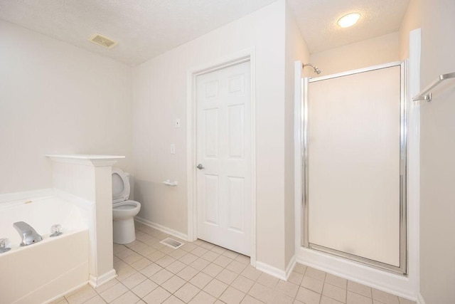 2818 Crazy Horse, Murfreesboro, TN 37127 - full bathroom with toilet, a stall shower, a textured ceiling, a bath, and tile patterned flooring