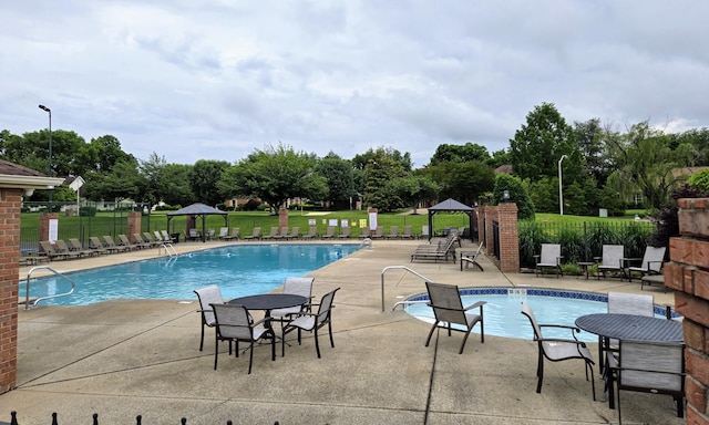 2818 Crazy Horse, Murfreesboro, TN 37127 - community pool featuring a patio and view of scattered trees