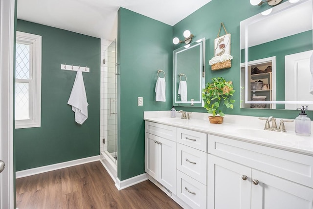 3120 Larkspur Dr, Nashville, TN 37207 - full bathroom with a stall shower, wood finished floors, double vanity, and baseboards