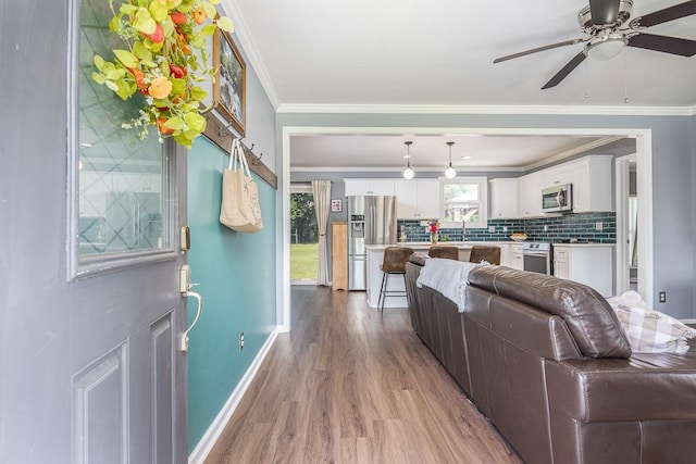 3120 Larkspur Dr, Nashville, TN 37207 - living area with wood finished floors, baseboards, ceiling fan, and ornamental molding