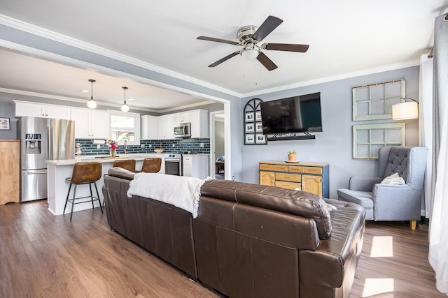 3120 Larkspur Dr, Nashville, TN 37207 - living room with dark wood-style flooring, a ceiling fan, and crown molding
