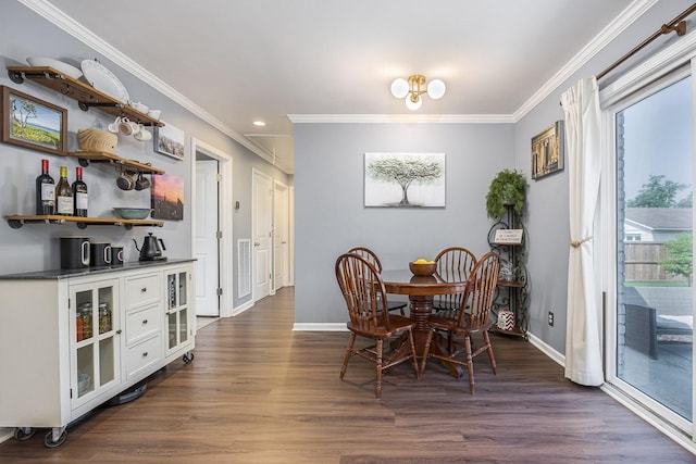 3120 Larkspur Dr, Nashville, TN 37207 - dining area featuring ornamental molding, baseboards, dark wood-style floors, a dry bar, and recessed lighting
