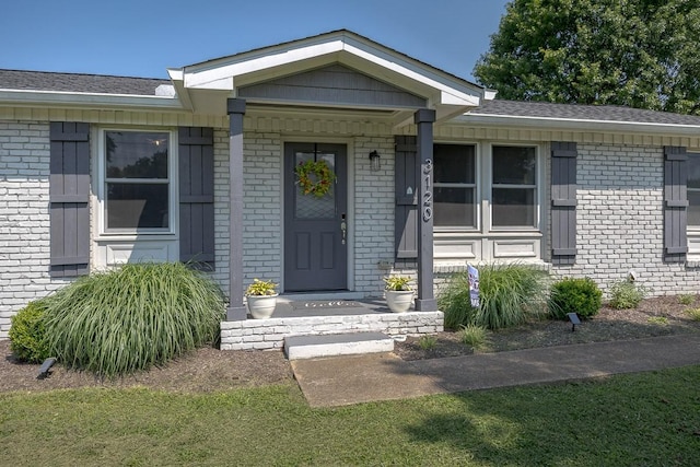 3120 Larkspur Dr, Nashville, TN 37207 - view of exterior entry featuring brick siding and roof with shingles