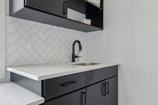 1016B 9th Ave S, Nashville, TN 37203 - kitchen featuring a sink, backsplash, light countertops, and open shelves