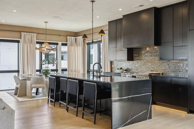 1016B 9th Ave S, Nashville, TN 37203 - kitchen featuring modern cabinets, a sink, light wood-type flooring, and recessed lighting