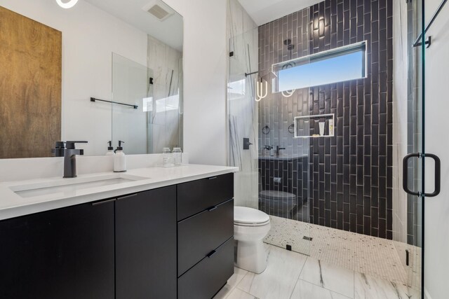 1016B 9th Ave S, Nashville, TN 37203 - bathroom with toilet, double vanity, and a stall shower