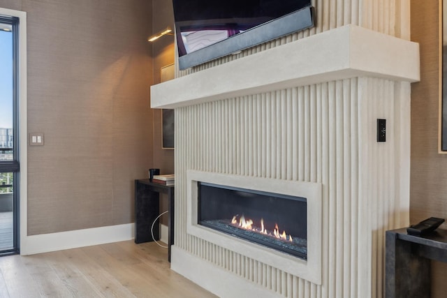 1016B 9th Ave S, Nashville, TN 37203 - detailed view of wood finished floors and a warm lit fireplace