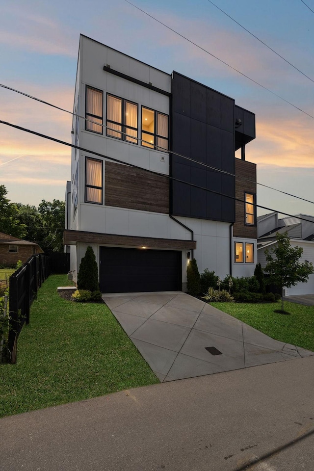 1016B 9th Ave S, Nashville, TN 37203 - modern home with an attached garage, a front yard, and driveway