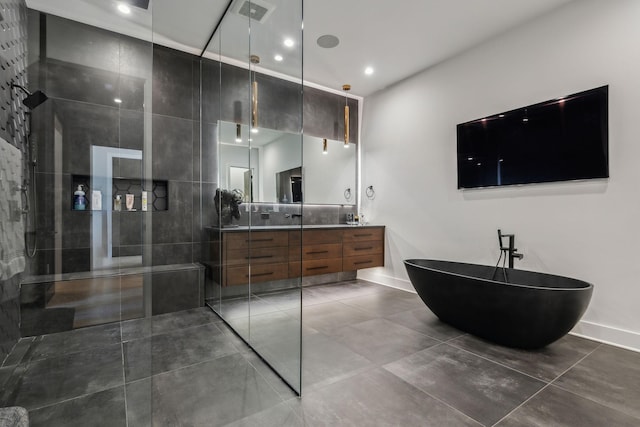 1016B 9th Ave S, Nashville, TN 37203 - full bath featuring double vanity, a freestanding tub, walk in shower, baseboards, and recessed lighting