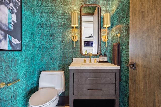 1016B 9th Ave S, Nashville, TN 37203 - bathroom with wallpapered walls, vanity, and toilet
