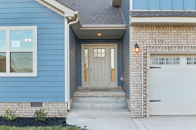 1271 Racker Dr, Clarksville, TN 37043 - view of exterior entry with a garage and roof with shingles
