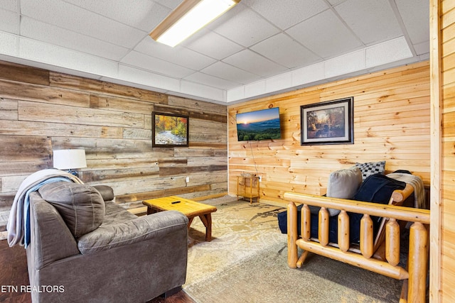 1815 Silver Poplar Ln, Sevierville, TN 37876 - carpeted living room with wood walls and a drop ceiling