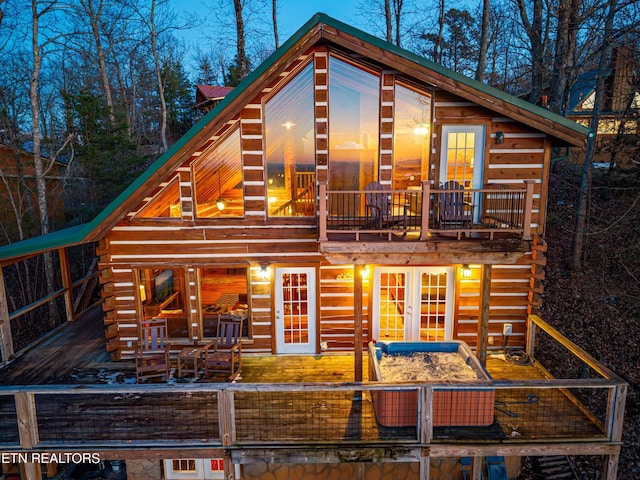 1815 Silver Poplar Ln, Sevierville, TN 37876 - back of property with french doors, a deck, and log siding