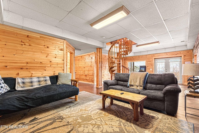 1815 Silver Poplar Ln, Sevierville, TN 37876 - living room featuring wood finished floors, wood walls, stairway, and a paneled ceiling