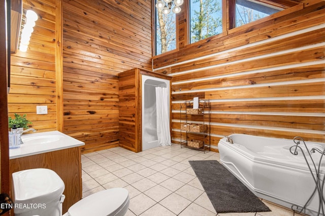 1815 Silver Poplar Ln, Sevierville, TN 37876 - full bath with a bath, tile patterned flooring, wooden walls, toilet, and vanity
