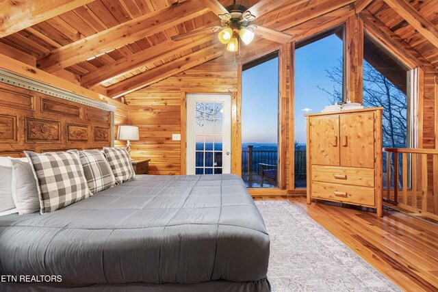 1815 Silver Poplar Ln, Sevierville, TN 37876 - bedroom with wooden ceiling, wood walls, hardwood / wood-style flooring, and access to outside
