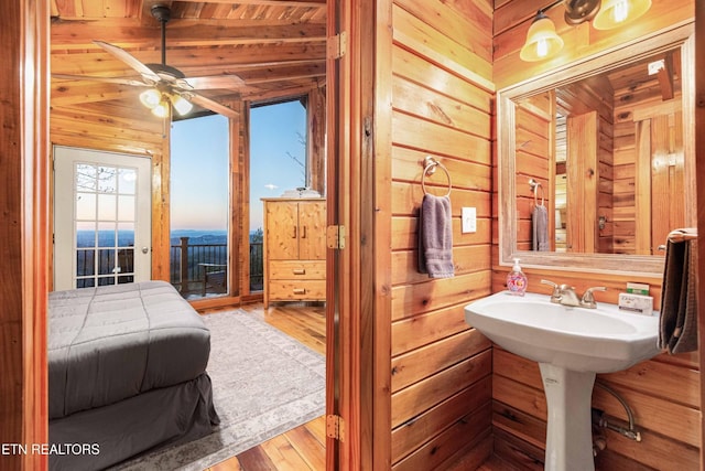 1815 Silver Poplar Ln, Sevierville, TN 37876 - bathroom featuring wooden walls, wood finished floors, ceiling fan, and wood ceiling