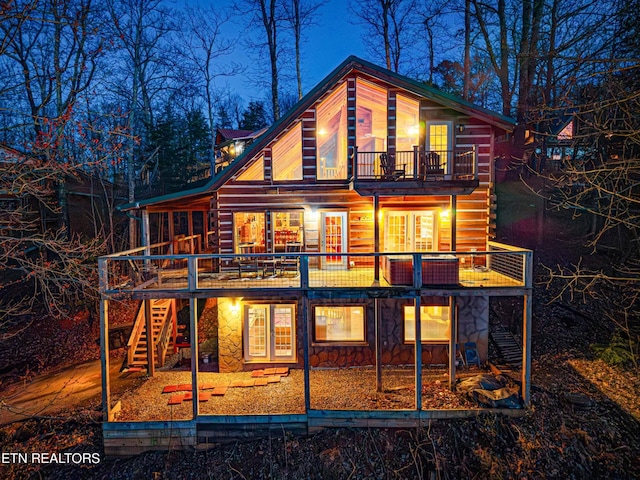 1815 Silver Poplar Ln, Sevierville, TN 37876 - back of house featuring a balcony, stairway, stone siding, and a deck
