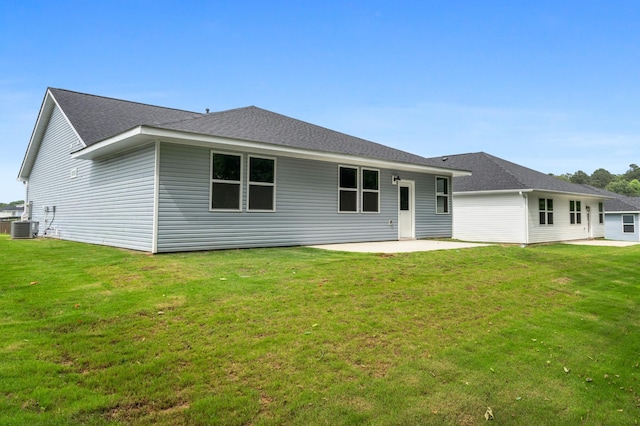 34 Aurora Cir, Fayetteville, TN 37334 - rear view of property featuring a patio, central AC unit, a lawn, and roof with shingles