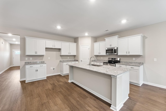 34 Aurora Cir, Fayetteville, TN 37334 - kitchen featuring appliances with stainless steel finishes, a sink, white cabinetry, dark wood-type flooring, and recessed lighting