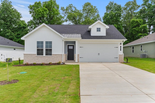 34 Aurora Cir, Fayetteville, TN 37334 - view of front of home with brick siding, board and batten siding, an attached garage, and central air condition unit