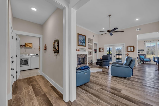 163 Autumn Wind Dr SW, Cleveland, TN 37311 - living room featuring washer and clothes dryer, ceiling fan, wood finished floors, a fireplace, and recessed lighting