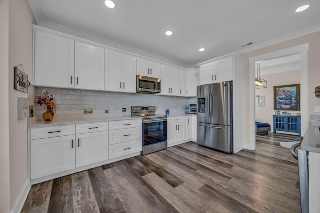 163 Autumn Wind Dr SW, Cleveland, TN 37311 - kitchen with appliances with stainless steel finishes, light countertops, white cabinets, tasteful backsplash, and recessed lighting