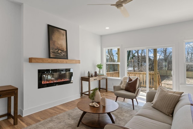 534 Green Ln, Whites Creek, TN 37189 - living area featuring a glass covered fireplace, wood finished floors, a ceiling fan, recessed lighting, and baseboards