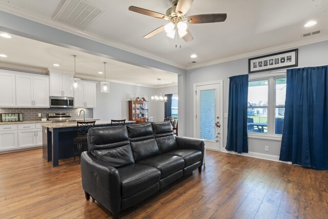 4115 Andes Dr, Murfreesboro, TN 37127 - living area featuring ceiling fan, hardwood / wood-style flooring, a chandelier, recessed lighting, and crown molding