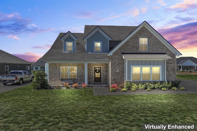 4115 Andes Dr, Murfreesboro, TN 37127 - view of front facade with a front lawn, brick siding, a shingled roof, and board and batten siding