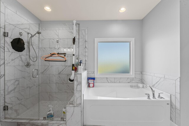 4115 Andes Dr, Murfreesboro, TN 37127 - full bath featuring a bath, a stall shower, and recessed lighting