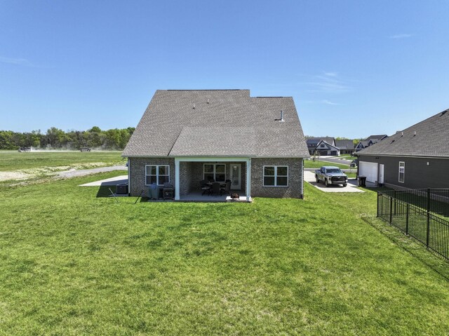 4115 Andes Dr, Murfreesboro, TN 37127 - rear view of house featuring a patio area, an attached garage, and roof with shingles
