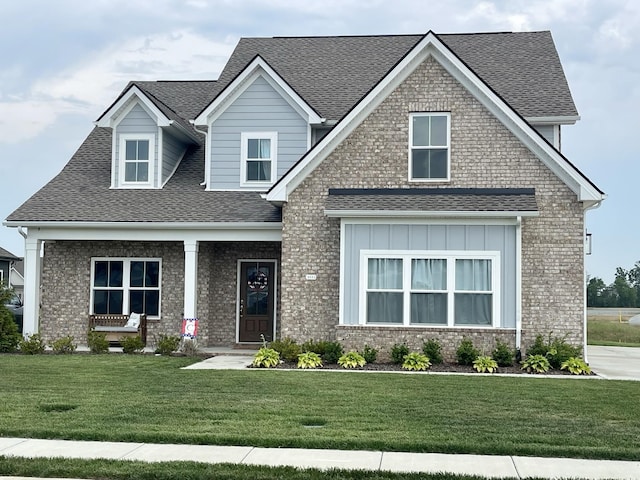 4115 Andes Dr, Murfreesboro, TN 37127 - craftsman-style house featuring a front yard, roof with shingles, brick siding, and board and batten siding