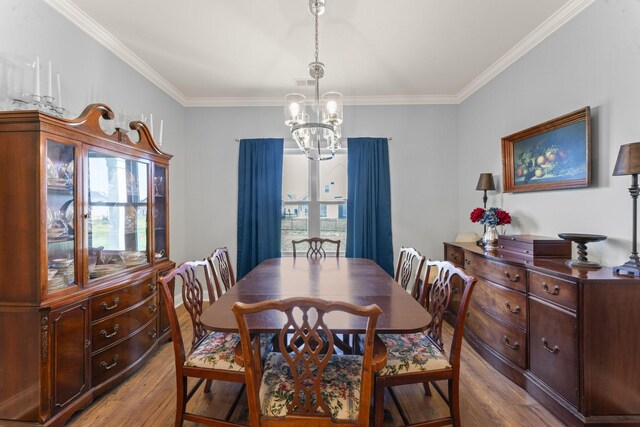 4115 Andes Dr, Murfreesboro, TN 37127 - dining area featuring wood finished floors, a chandelier, and crown molding