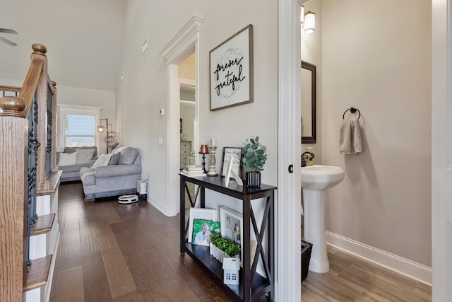 1114 Escalade Ct, Lascassas, TN 37085 - hallway featuring dark wood-type flooring, baseboards, and a sink