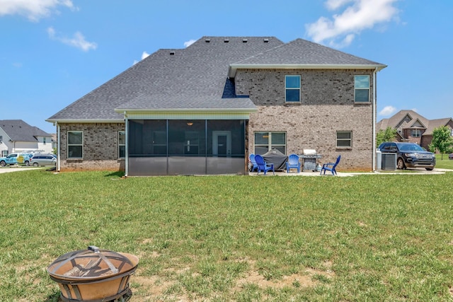 1114 Escalade Ct, Lascassas, TN 37085 - rear view of house featuring an outdoor fire pit, a sunroom, and a lawn