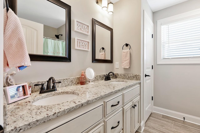 1114 Escalade Ct, Lascassas, TN 37085 - bathroom featuring double vanity, baseboards, and wood finished floors