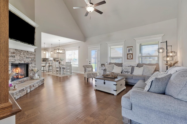 1114 Escalade Ct, Lascassas, TN 37085 - living area with ceiling fan, a stone fireplace, dark wood-type flooring, high vaulted ceiling, and a chandelier