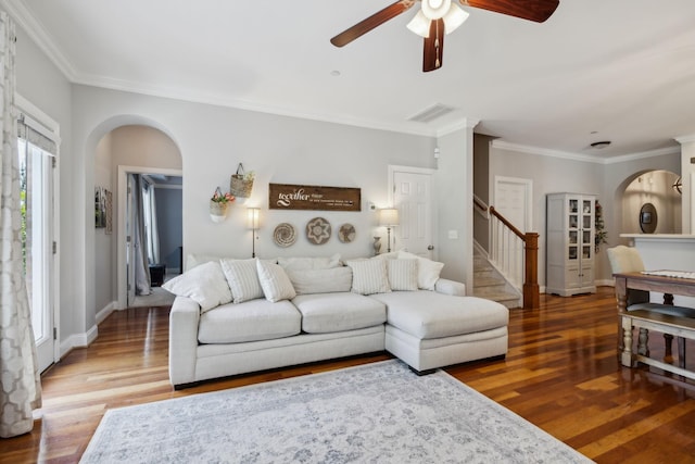 3324 Redmon Hl, Nolensville, TN 37135 - living room featuring arched walkways, a ceiling fan, stairs, wood finished floors, and crown molding