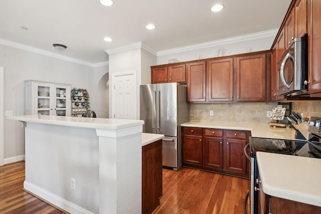 3324 Redmon Hl, Nolensville, TN 37135 - kitchen featuring stainless steel appliances, arched walkways, dark wood-type flooring, light countertops, and a kitchen island