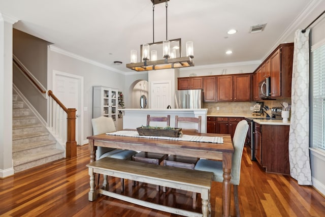 3324 Redmon Hl, Nolensville, TN 37135 - dining space with dark wood-style floors, stairs, recessed lighting, crown molding, and a chandelier