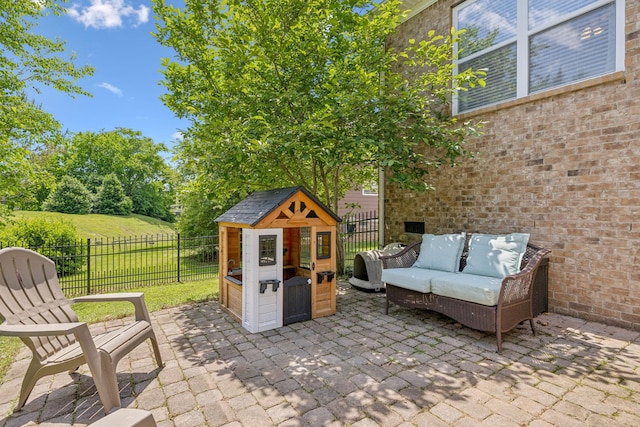 3324 Redmon Hl, Nolensville, TN 37135 - fenced backyard with a patio, an outdoor hangout area, and an outbuilding