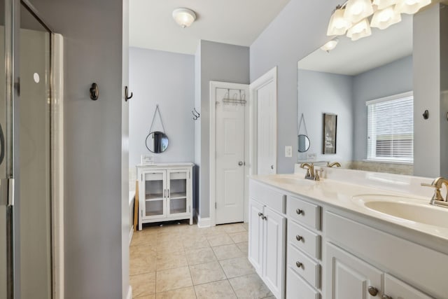 3324 Redmon Hl, Nolensville, TN 37135 - bathroom featuring double vanity, a shower stall, tile patterned flooring, and baseboards