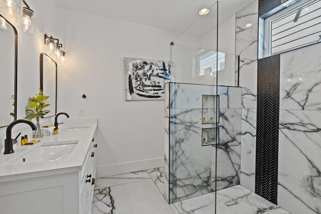 1203B Brick Church Pike, Nashville, TN 37207 - bathroom featuring marble finish floors, double vanity, a marble finish shower, and baseboards